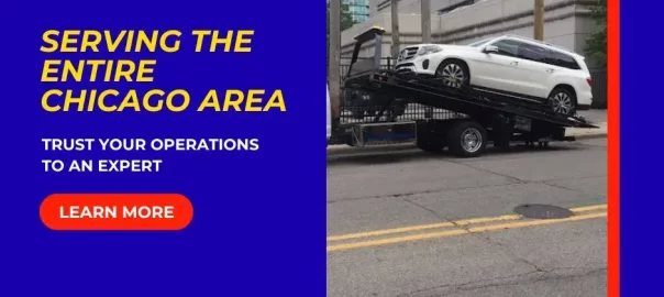 Flatbed tow truck loading a white SUV for emergency towing in Chicago, Illinois