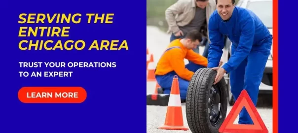 Roadside support team performing tire change and towing service in Rogers Park, IL